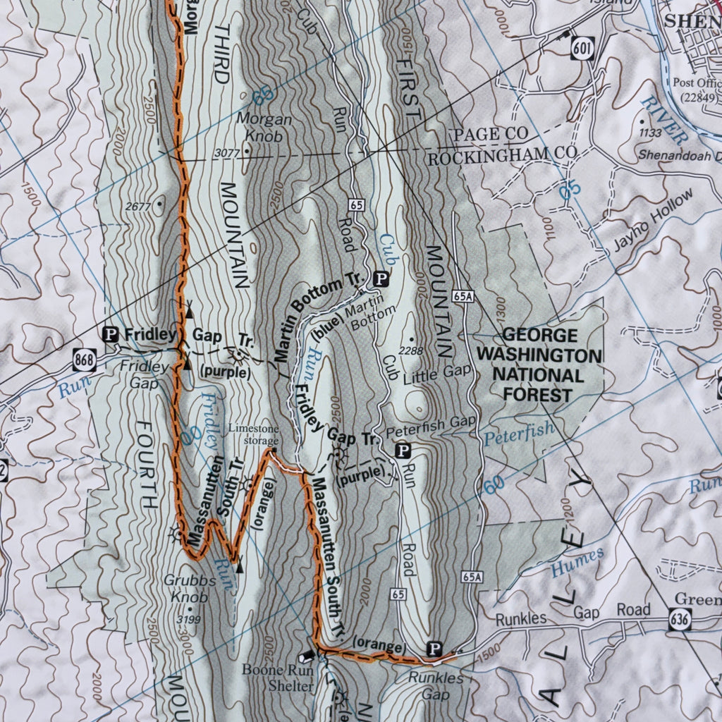 Topographic map of a mountainous area with trail names and forest designations.
