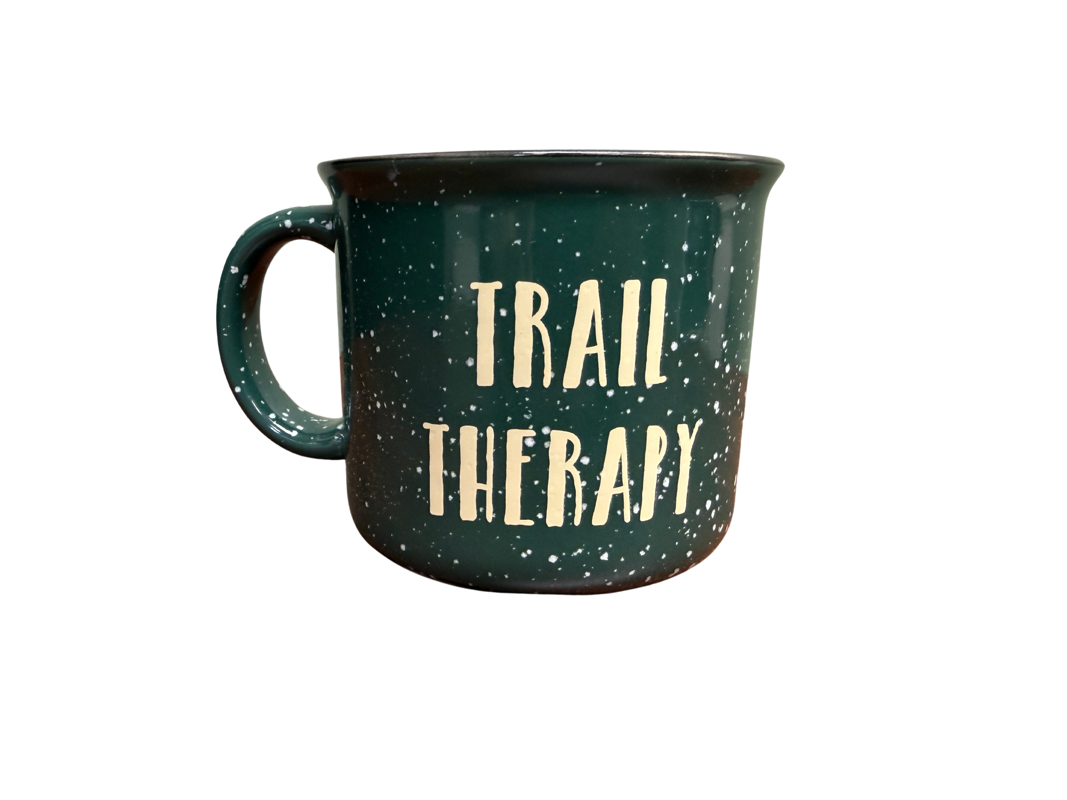 Green mug with 'Trail Therapy' text on a white background
