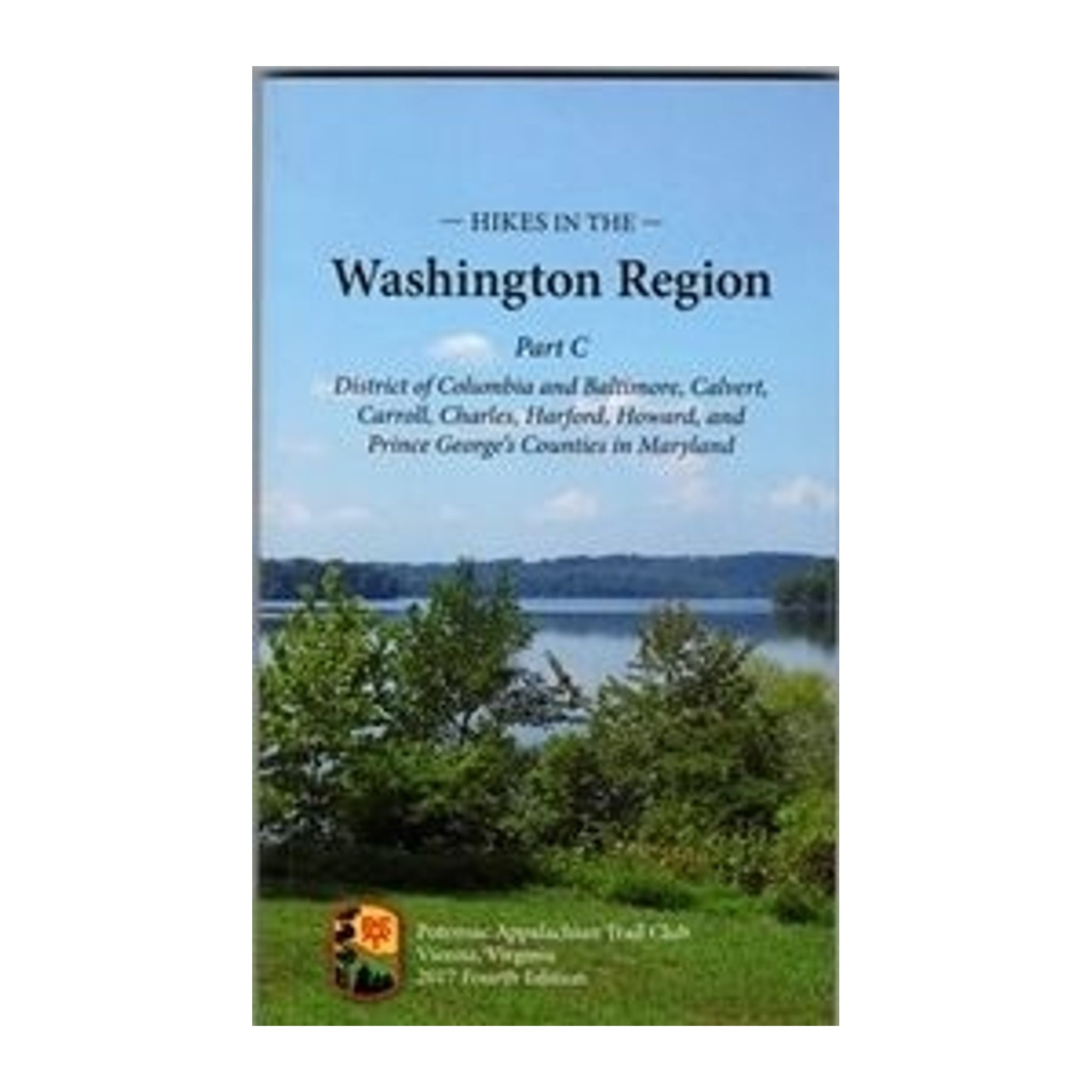 Book cover of 'Hikes in the Washington Region' with a scenic view of trees and water.